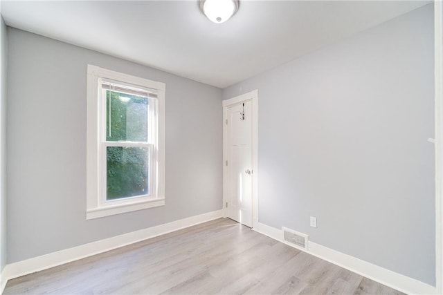 unfurnished room featuring light hardwood / wood-style floors