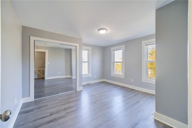 empty room with dark hardwood / wood-style floors