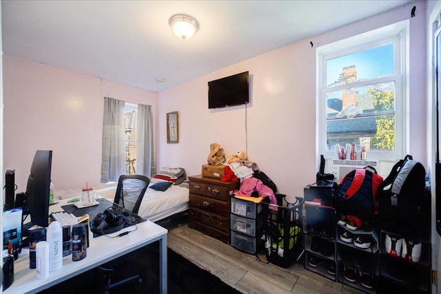 office space featuring hardwood / wood-style floors and cooling unit