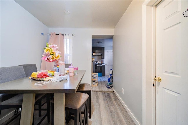 dining room with hardwood / wood-style flooring