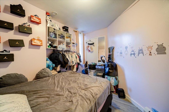 bedroom with hardwood / wood-style floors