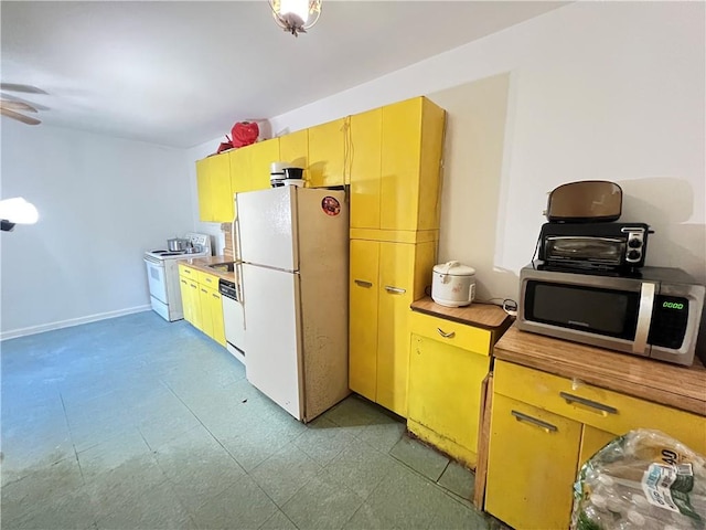 kitchen with ceiling fan and white appliances