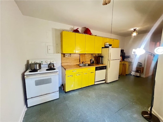 kitchen featuring white appliances, sink, and tasteful backsplash