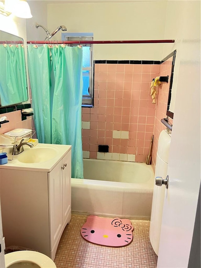 bathroom with tile walls