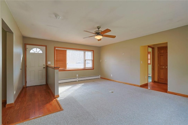 foyer featuring ceiling fan, light hardwood / wood-style floors, and a baseboard radiator