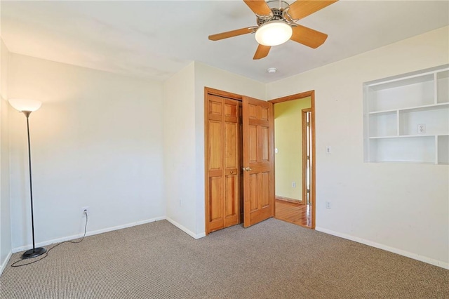 unfurnished bedroom with ceiling fan, a closet, and light carpet