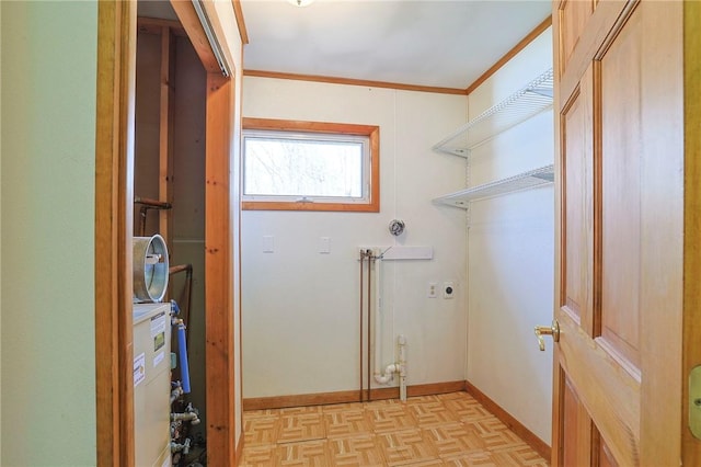 laundry room with light parquet floors and ornamental molding