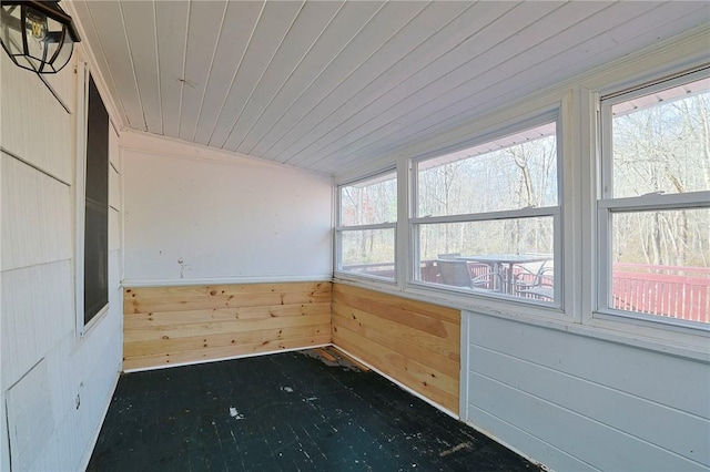 unfurnished sunroom with wooden ceiling