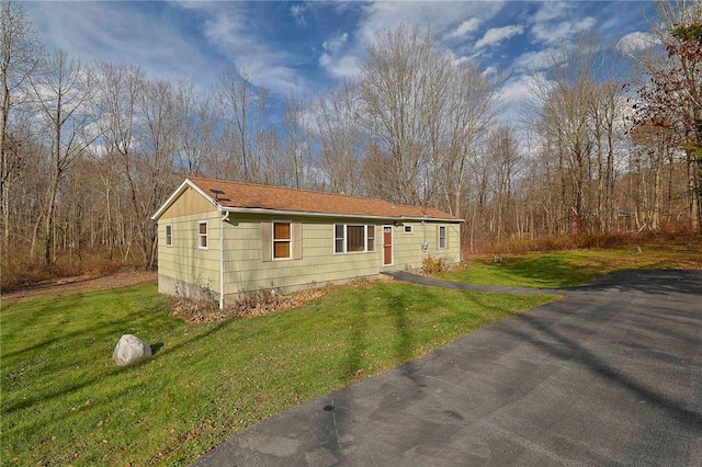 view of home's exterior featuring a yard