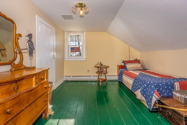 bedroom featuring dark hardwood / wood-style flooring, vaulted ceiling, and baseboard heating