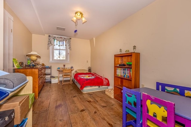 bedroom with hardwood / wood-style floors