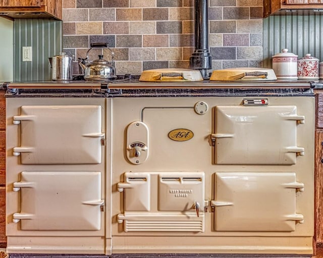 room details featuring tasteful backsplash and stove