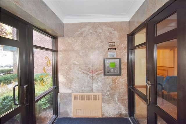 interior space featuring radiator and ornamental molding