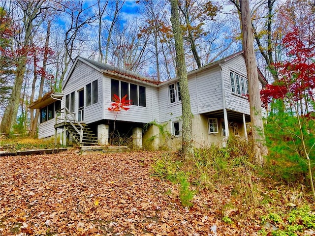 view of front of home with a sunroom