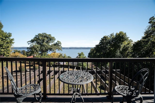 balcony featuring a water view