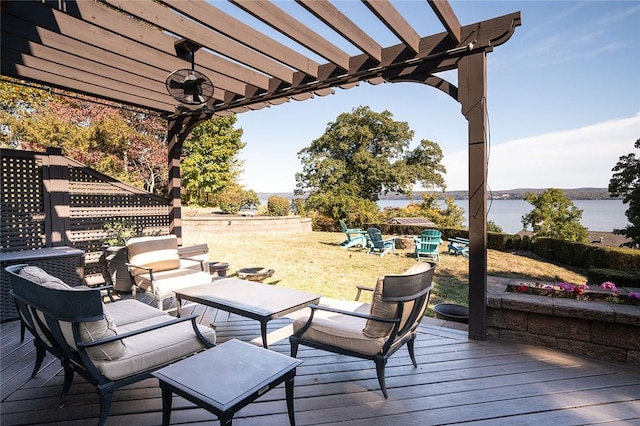 wooden deck featuring a water view and a pergola