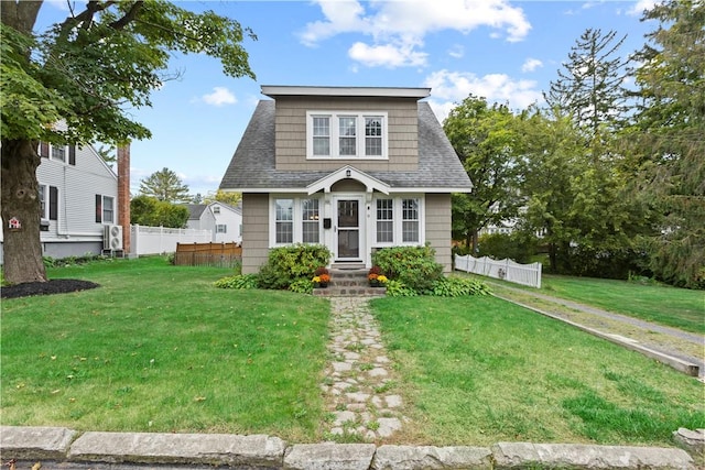 bungalow-style house with a front yard