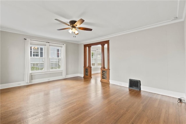 spare room featuring crown molding, ceiling fan, and hardwood / wood-style flooring