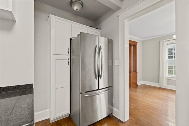 kitchen with white cabinets, stainless steel fridge, and dark hardwood / wood-style flooring