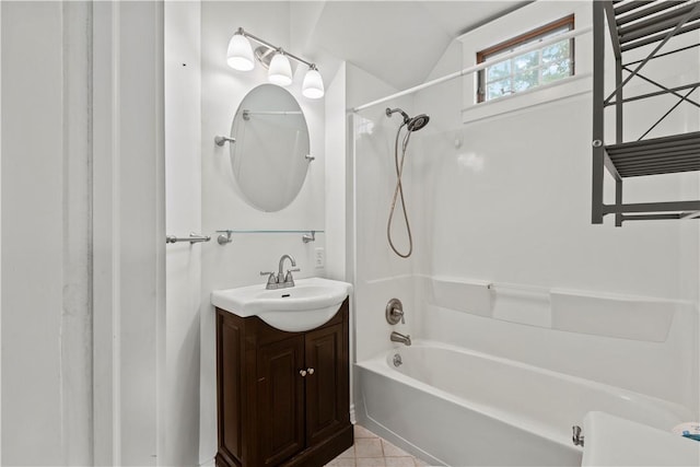 bathroom with bathtub / shower combination, vanity, tile patterned floors, and lofted ceiling