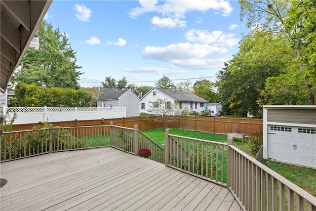 wooden terrace featuring a yard