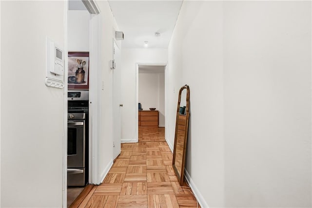 hallway with light parquet flooring