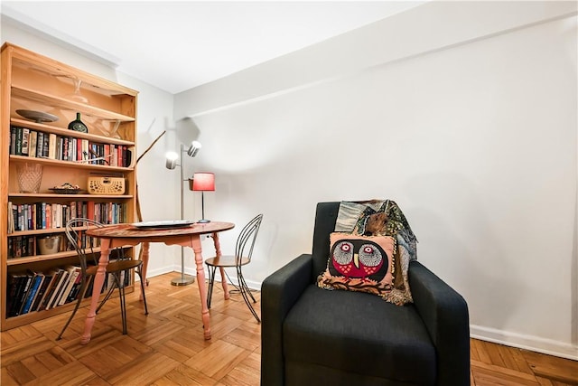 living area featuring light parquet floors