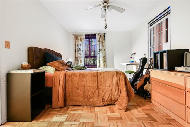 bedroom featuring ceiling fan and light parquet floors