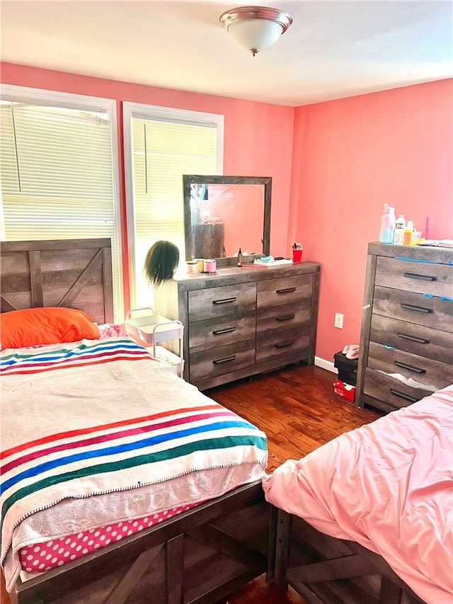 bedroom featuring dark wood-type flooring