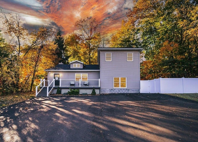 back of house featuring a deck