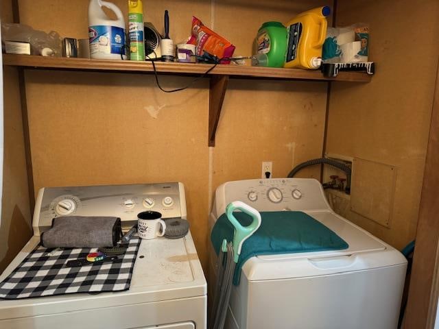 laundry area with washing machine and clothes dryer