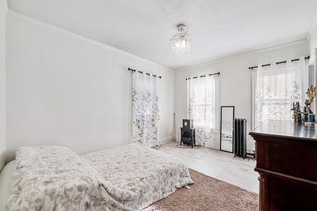 bedroom with ornamental molding, a wood stove, and an inviting chandelier