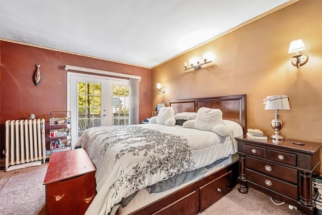 carpeted bedroom with radiator heating unit, crown molding, and access to outside