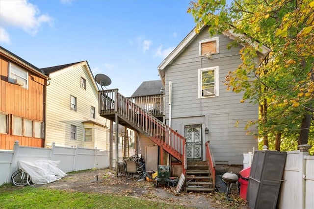 rear view of house with a wooden deck