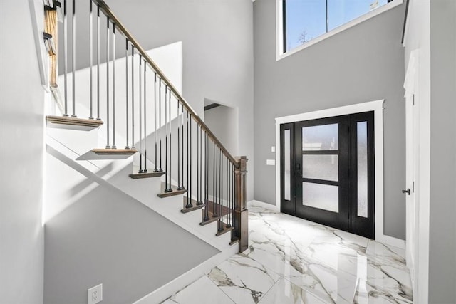 foyer featuring a high ceiling