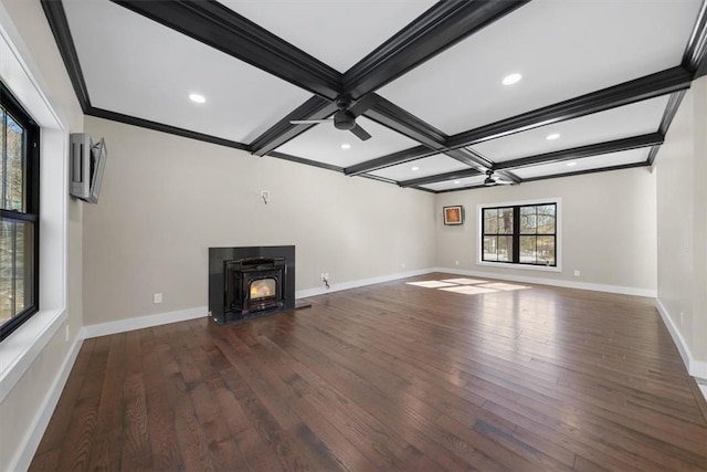 unfurnished living room with dark hardwood / wood-style flooring, ceiling fan, and a healthy amount of sunlight