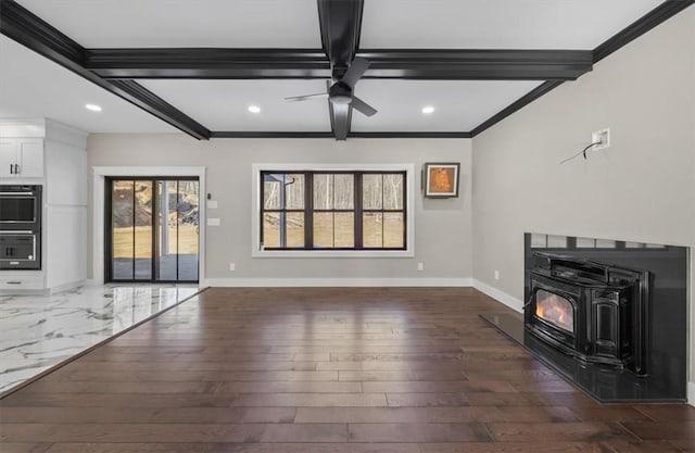 unfurnished living room with beamed ceiling, dark hardwood / wood-style flooring, ceiling fan, and ornamental molding