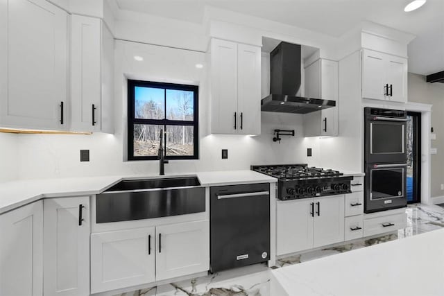 kitchen featuring sink, wall chimney exhaust hood, gas stovetop, double oven, and white cabinetry