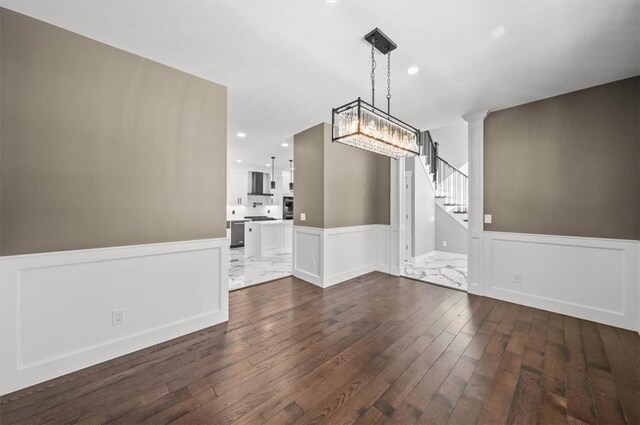 interior space with an inviting chandelier and dark wood-type flooring