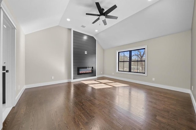 unfurnished living room with ceiling fan, a large fireplace, dark hardwood / wood-style flooring, and vaulted ceiling