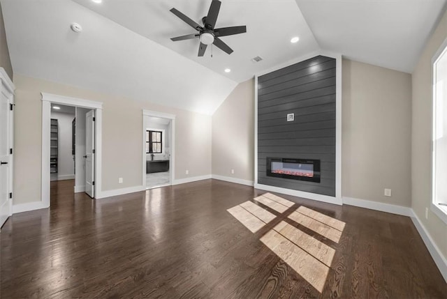 unfurnished living room featuring a large fireplace, dark wood-type flooring, ceiling fan, and lofted ceiling