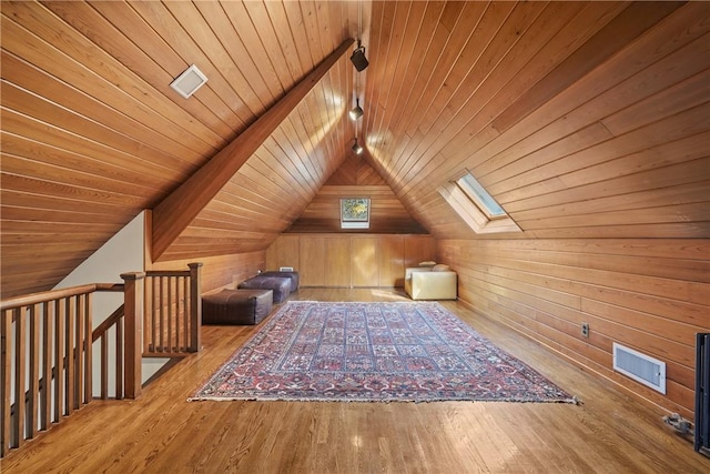 additional living space featuring wood ceiling, visible vents, vaulted ceiling, and wood finished floors