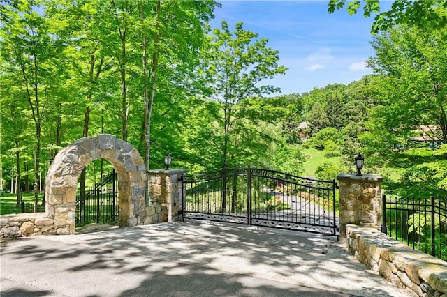 view of gate with fence