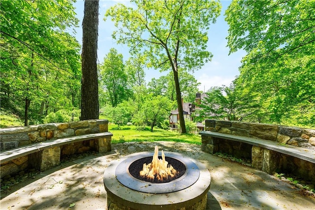 view of patio / terrace featuring an outdoor fire pit