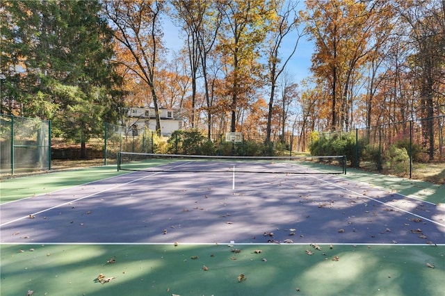 view of sport court featuring fence