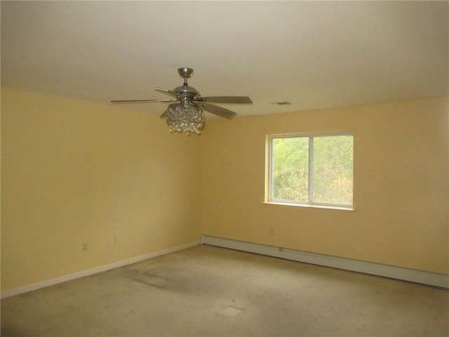 carpeted spare room featuring a baseboard heating unit