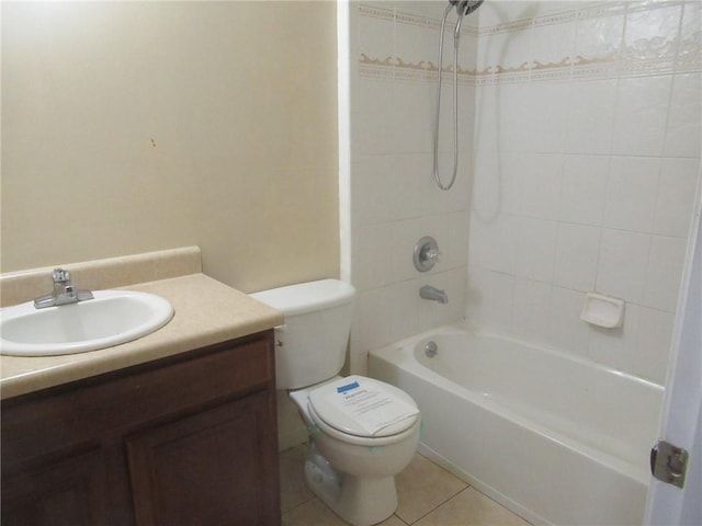 full bathroom featuring tile patterned floors, toilet, vanity, and tiled shower / bath