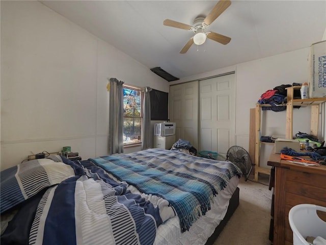 bedroom with carpet flooring, ceiling fan, lofted ceiling, and a closet