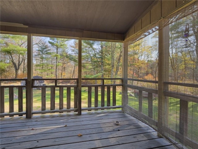 unfurnished sunroom with wood ceiling