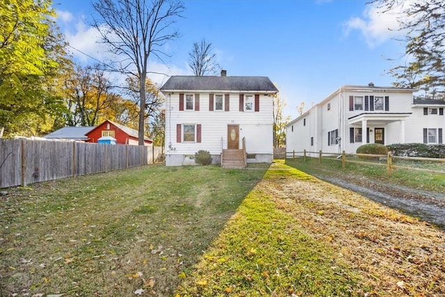 view of front of property with a front lawn